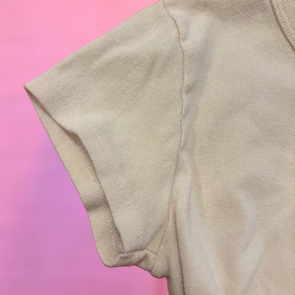 Brandy Melville Off White Creme “I don’t care” fairy graphic baby tee, small - Picture 4 of 7